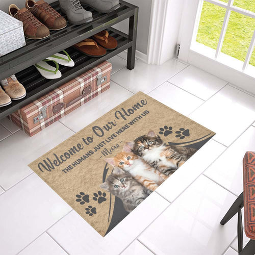 The Humans Just Live Here With Us Cat DoorMat